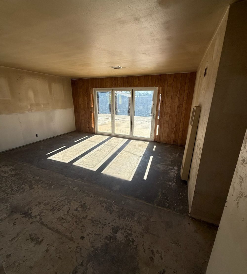 Empty room with bare floors after a full house cleanout