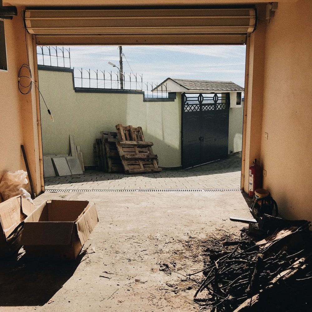 Empty garage with a few boxes left after a cleanout